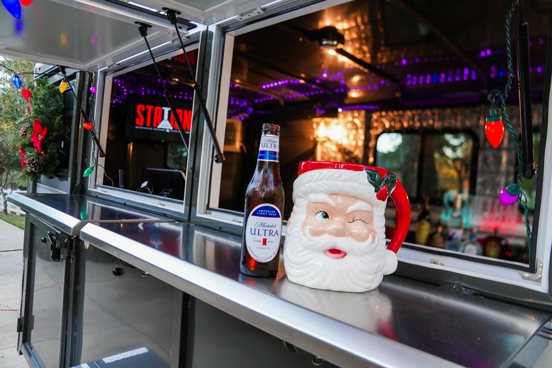 Beer and santa mug sitting on The Station's Mobile Bar Serving Counter