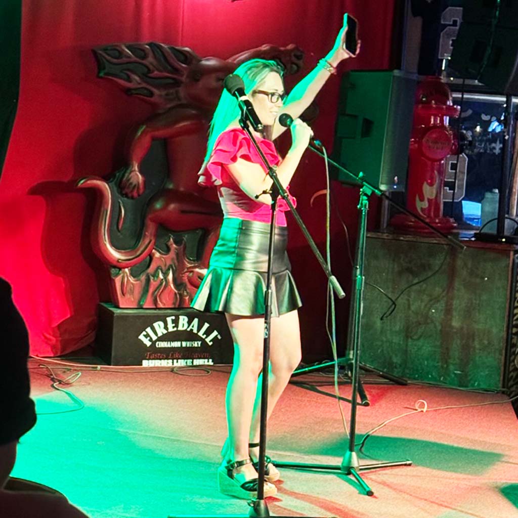 photo of woman singing karaoke at The Station in Baton Rouge, Louisiana